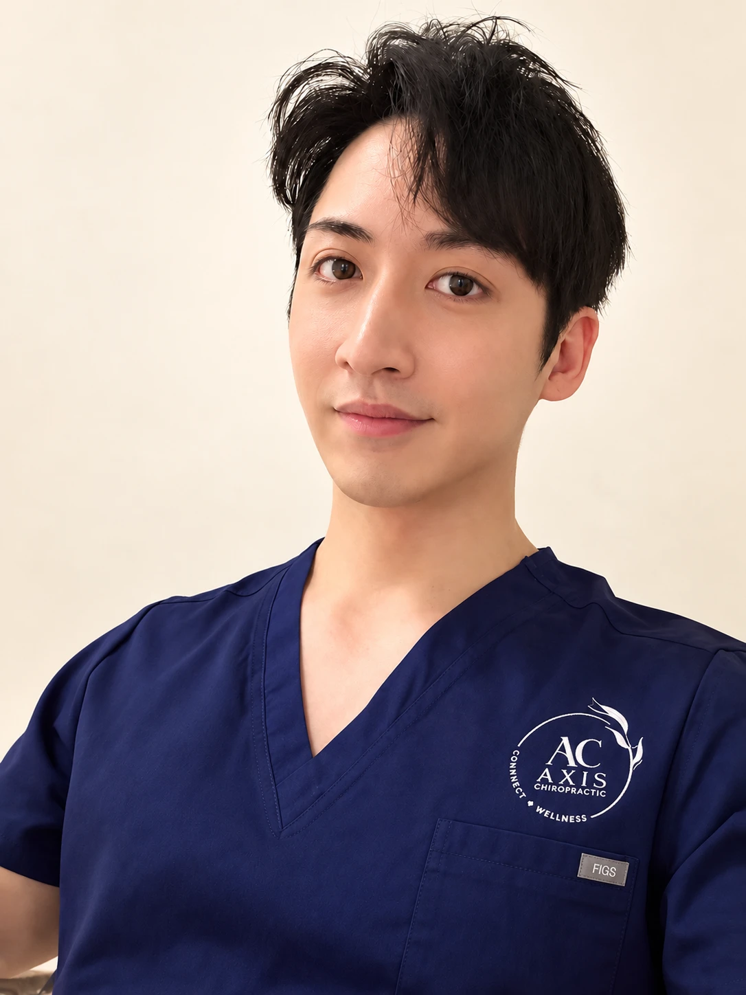 Dr Lu Wen’An wearing navy blue scrubs